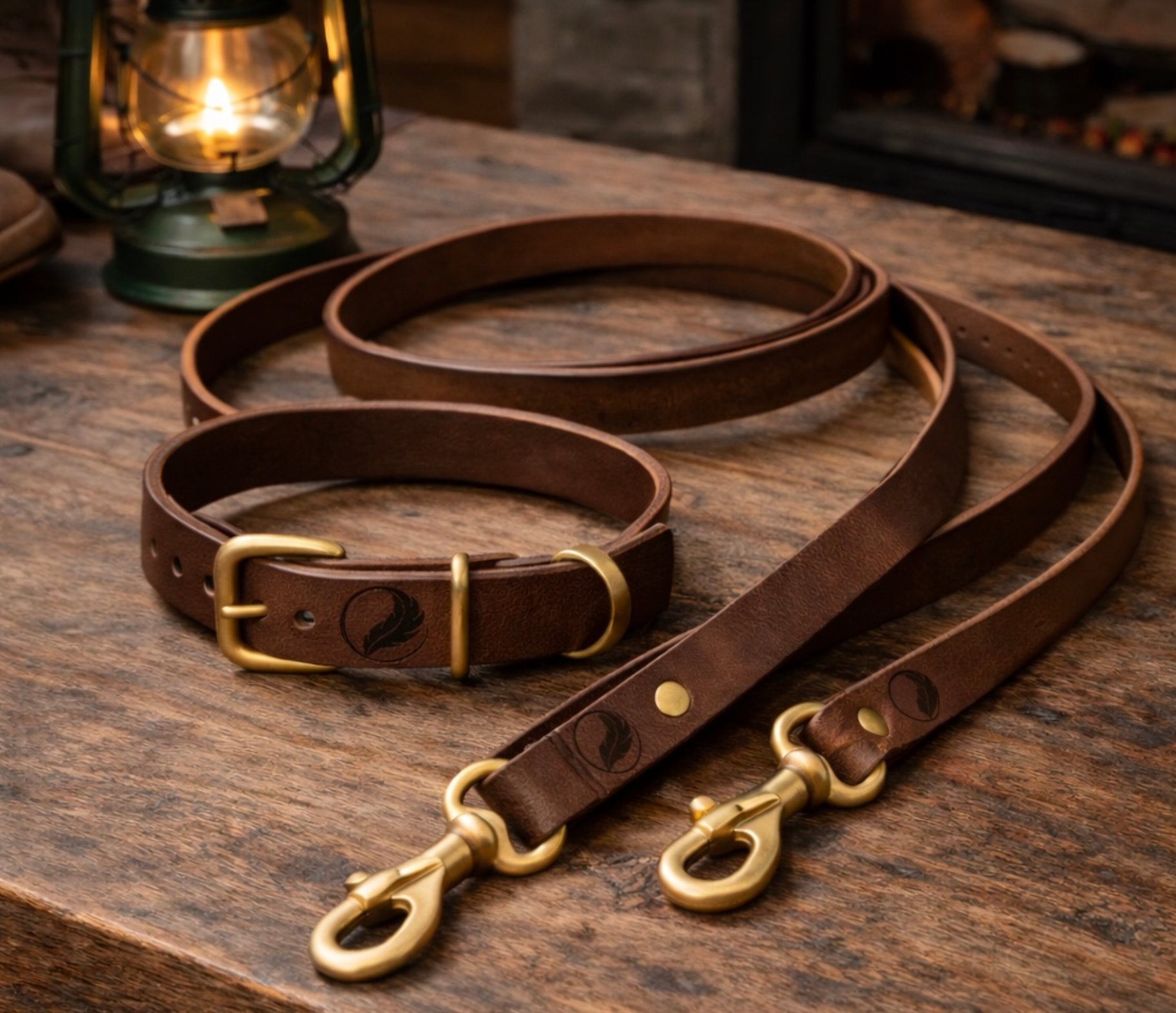 Flight Outdoors leather dog collar and leash set with solid brass hardware on rustic wood table